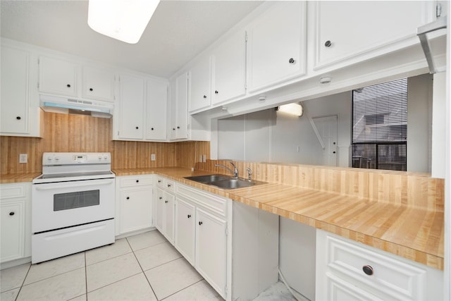 13742 Hollowgreen Dr Unit 604, Houston, TX 77082 - kitchen featuring electric stove, under cabinet range hood, a sink, light tile patterned floors, and white cabinets