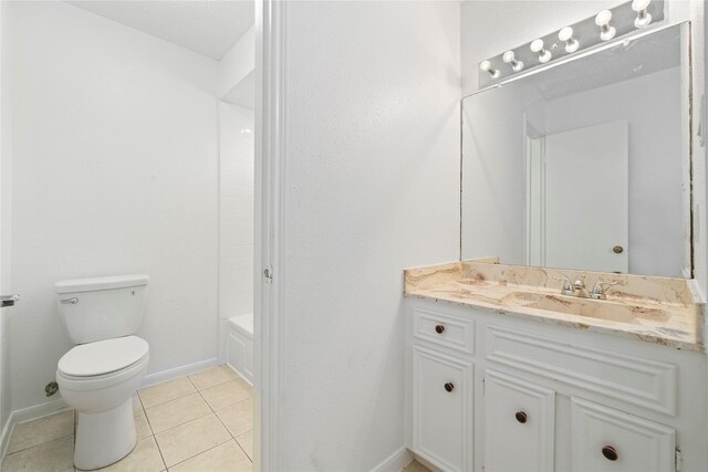 13742 Hollowgreen Dr Unit 604, Houston, TX 77082 - full bathroom featuring toilet, tile patterned flooring, vanity, and baseboards