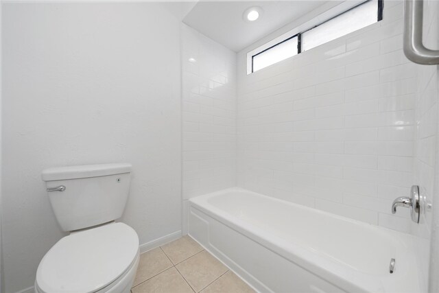 13742 Hollowgreen Dr Unit 604, Houston, TX 77082 - bathroom featuring tile patterned flooring, toilet, baseboards, and tub / shower combination