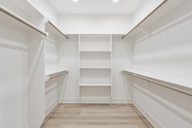 spacious closet featuring light wood finished floors
