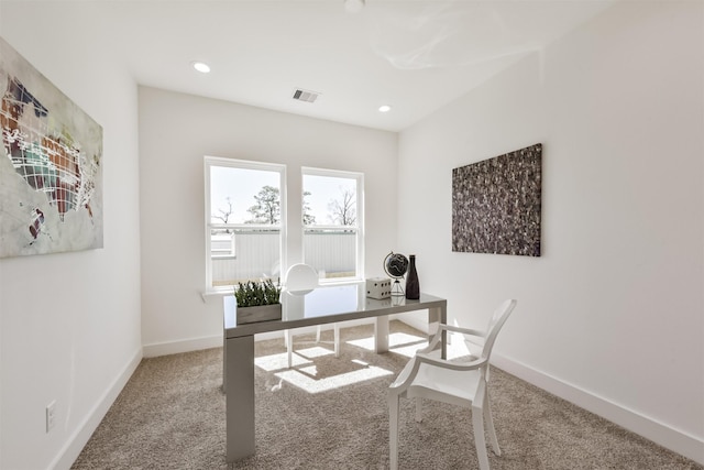 carpeted office space with recessed lighting, baseboards, and visible vents