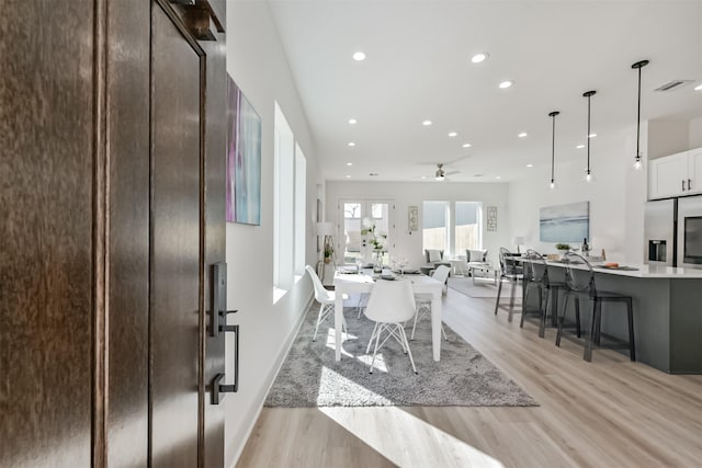 interior space with ceiling fan, recessed lighting, light wood-style flooring, and visible vents