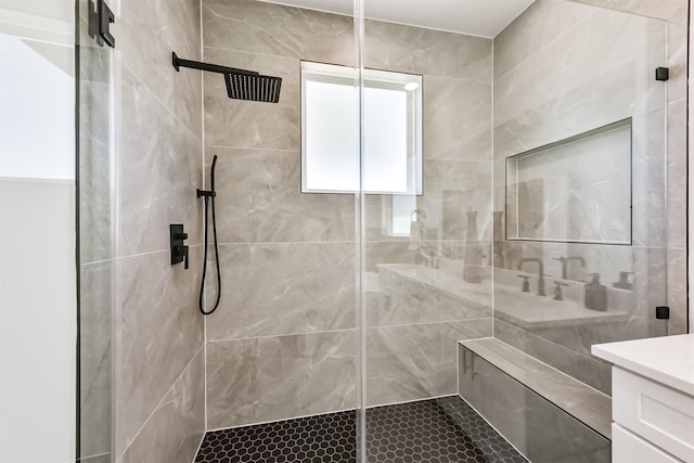 full bath featuring vanity and a shower stall