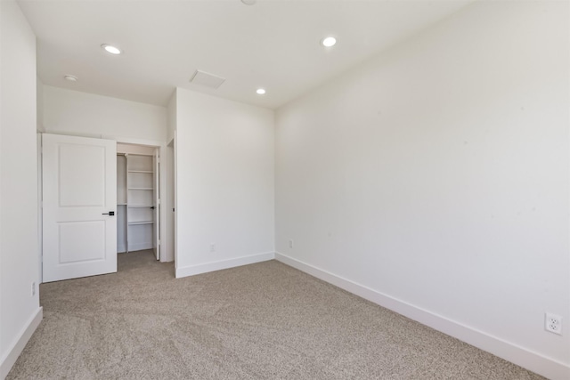 unfurnished bedroom featuring carpet floors, recessed lighting, and baseboards