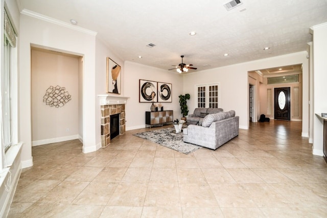 13819 Laurel Colony Trl, Houston, TX 77059 - living room featuring a ceiling fan, crown molding, a fireplace, visible vents, and recessed lighting