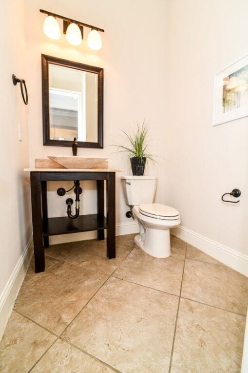 13819 Laurel Colony Trl, Houston, TX 77059 - bathroom with toilet, baseboards, and a sink