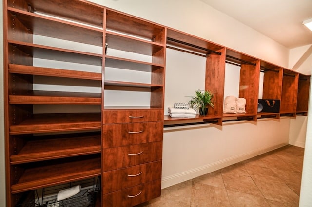 13819 Laurel Colony Trl, Houston, TX 77059 - spacious closet featuring light tile patterned floors
