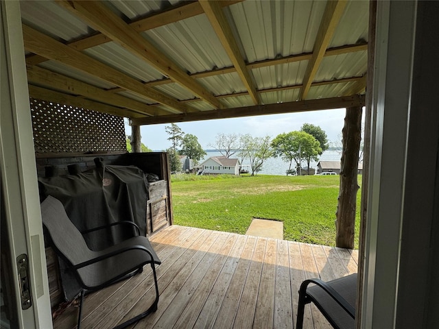 wooden deck featuring a yard