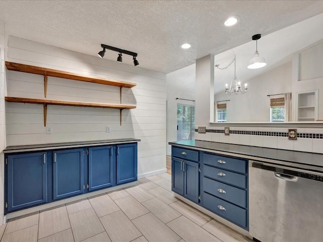 kitchen featuring blue cabinets, an inviting chandelier, stainless steel dishwasher, open shelves, and wooden walls