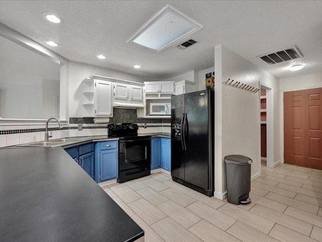 kitchen with open shelves, a sink, visible vents, black appliances, and blue cabinetry