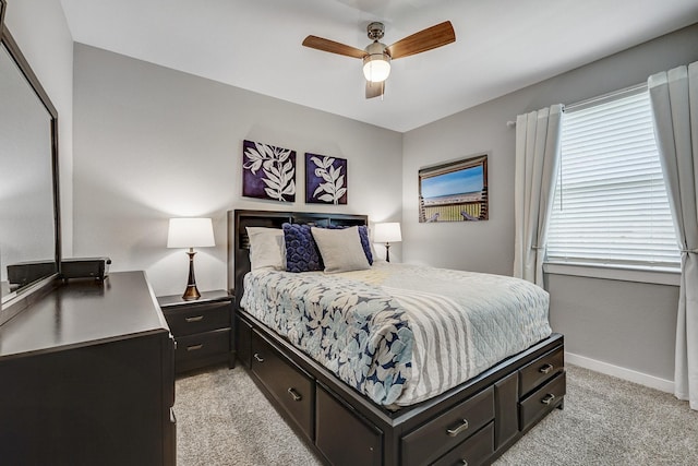 14302 Winema View Ln, Conroe, TX 77384 - bedroom featuring light carpet, baseboards, and ceiling fan