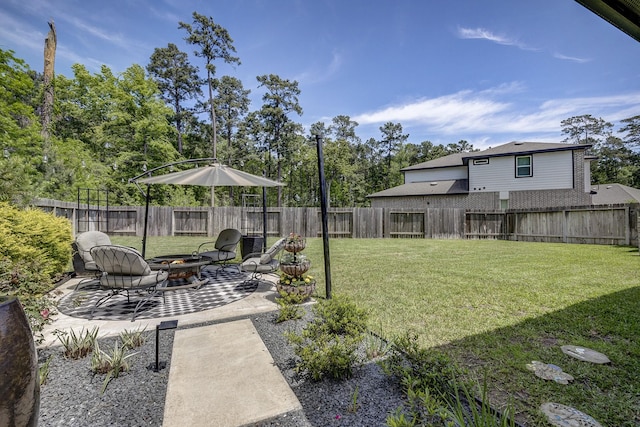 14302 Winema View Ln, Conroe, TX 77384 - view of yard with a fire pit and a patio