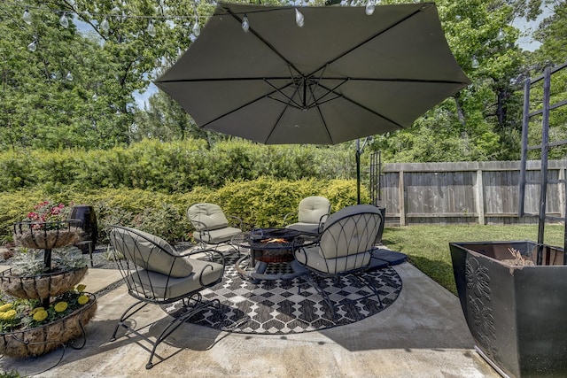 14302 Winema View Ln, Conroe, TX 77384 - view of patio featuring an outdoor fire pit