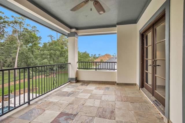 balcony featuring french doors and a ceiling fan