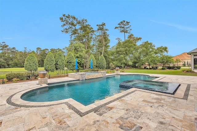 view of swimming pool with a patio area, a pool with connected hot tub, and fence