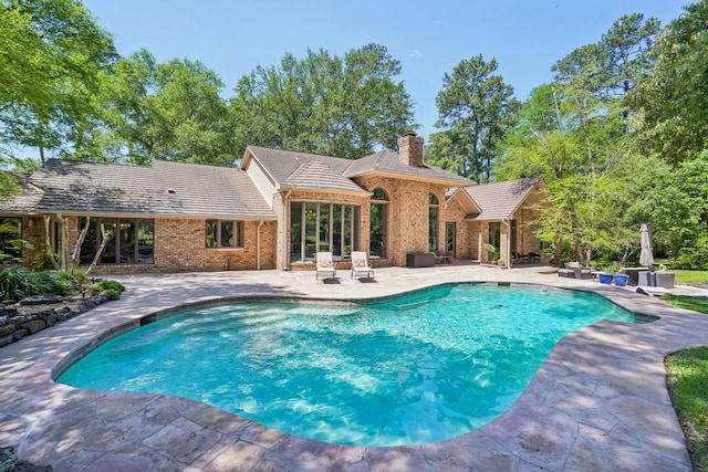 33302 Alton Wright Dr, Magnolia, TX 77355 - outdoor pool with a patio