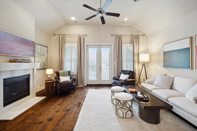 living room featuring lofted ceiling, dark wood-style floors, ceiling fan, and french doors