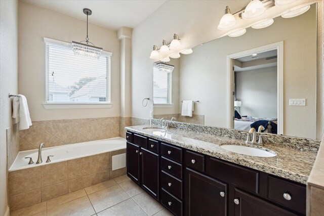 full bathroom with a bath, tile patterned floors, ensuite bath, and a sink