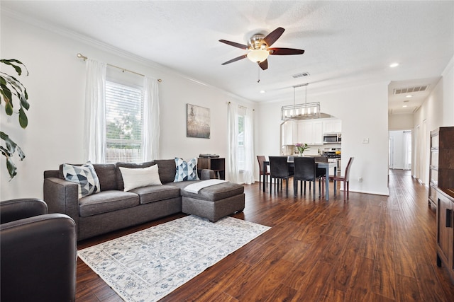 701 Coronado St, Houston, TX 77009 - living area with ceiling fan, dark wood-style floors, crown molding, and recessed lighting
