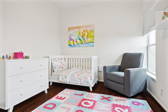 701 Coronado St, Houston, TX 77009 - bedroom with wood finished floors and a crib