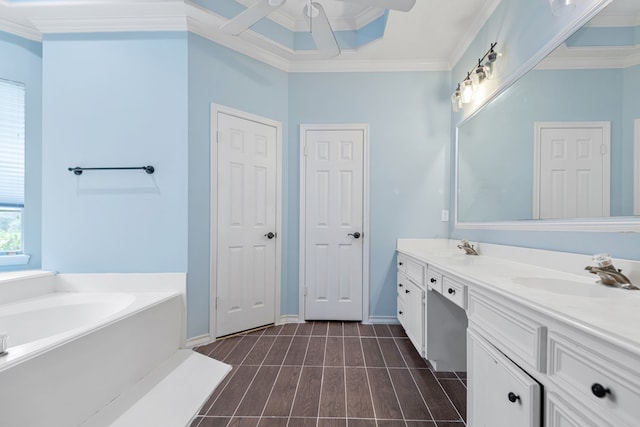 bathroom with crown molding, a sink, double vanity, a ceiling fan, and a bath