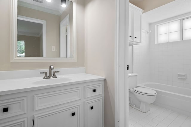 bathroom with vanity, tile patterned floors, a wealth of natural light, and toilet
