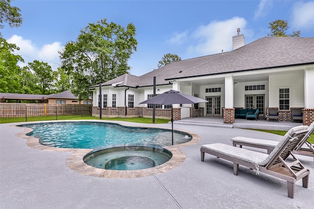 8118 S Laura Cir, Baytown, TX 77521 - view of pool with french doors, fence, a pool with connected hot tub, an outdoor hangout area, and a patio area