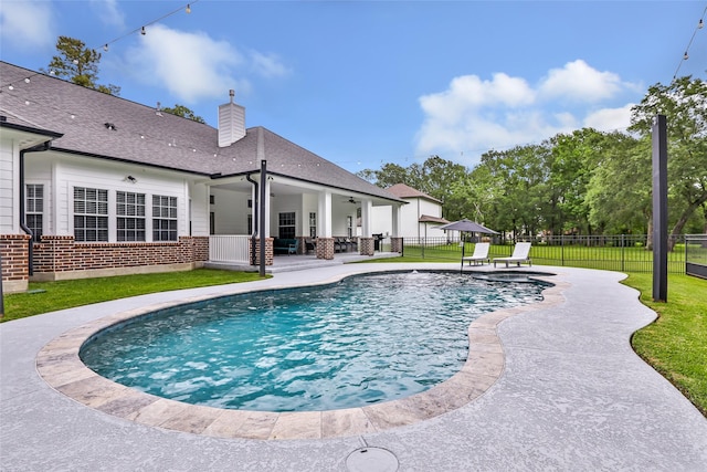 8118 S Laura Cir, Baytown, TX 77521 - view of swimming pool featuring a ceiling fan, a yard, a fenced in pool, a patio, and a fenced backyard