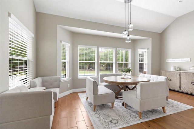 8118 S Laura Cir, Baytown, TX 77521 - dining space featuring vaulted ceiling, light wood-style flooring, and baseboards