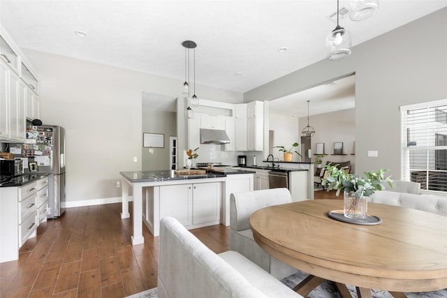 8118 S Laura Cir, Baytown, TX 77521 - dining space with baseboards, recessed lighting, and dark wood-type flooring