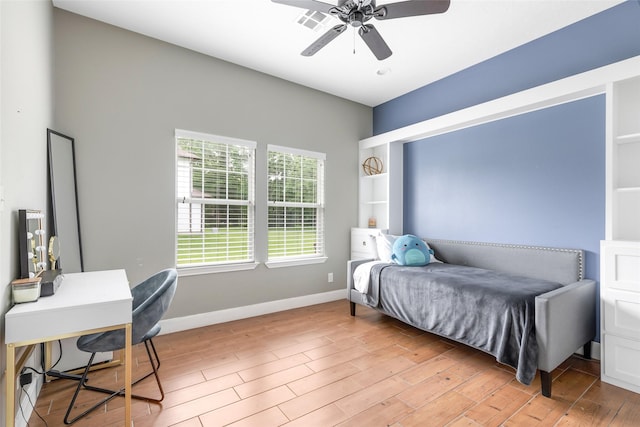 8118 S Laura Cir, Baytown, TX 77521 - bedroom featuring light wood finished floors, baseboards, ceiling fan, and visible vents