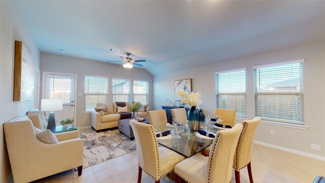 dining space featuring light tile patterned floors, baseboards, ceiling fan, and visible vents