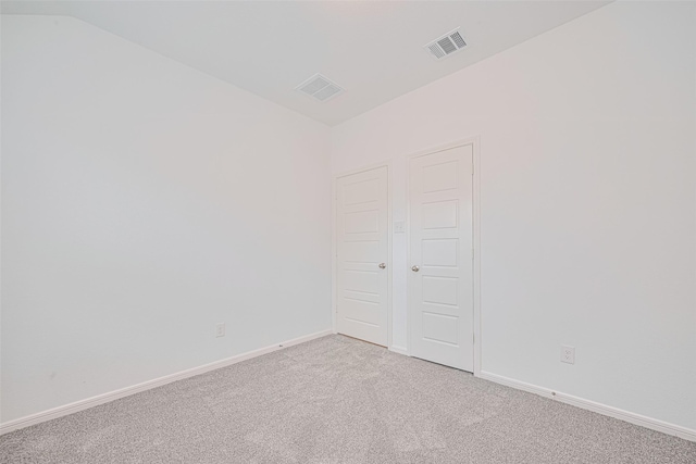 17722 Pamukkale Pl, Tomball, TX 77377 - spare room featuring light colored carpet, baseboards, and lofted ceiling