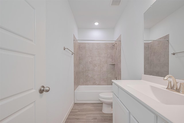 17722 Pamukkale Pl, Tomball, TX 77377 - bathroom featuring toilet, wood finished floors, vanity, and tub / shower combination