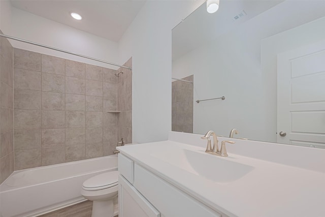 17722 Pamukkale Pl, Tomball, TX 77377 - bathroom featuring toilet, bathing tub / shower combination, vanity, wood finished floors, and recessed lighting