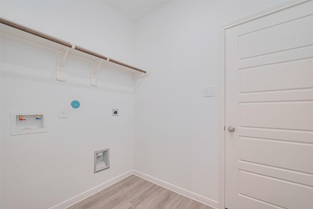17722 Pamukkale Pl, Tomball, TX 77377 - washroom with electric dryer hookup, light wood-style flooring, hookup for a washing machine, and baseboards