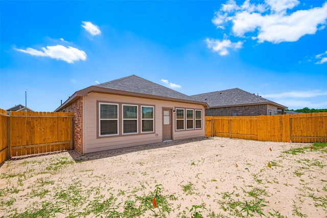 17722 Pamukkale Pl, Tomball, TX 77377 - back of house featuring a fenced backyard and a shingled roof