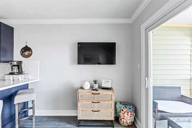 6300 Seawall Blvd Unit 3225, Galveston, TX 77551 - interior details featuring decorative backsplash, baseboards, ornamental molding, and wood finished floors