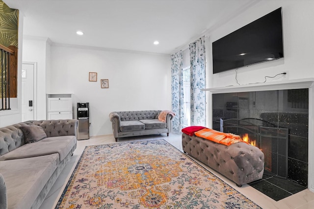 living room featuring recessed lighting and a fireplace with flush hearth