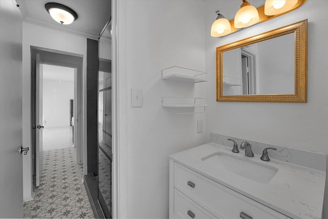 bathroom with tile patterned floors, vanity, and ornamental molding