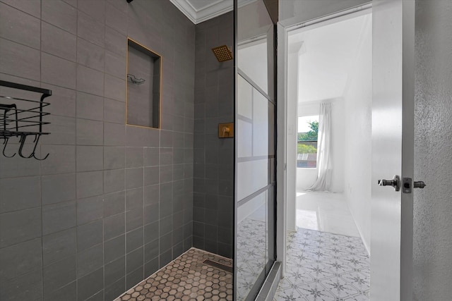 bathroom with tiled shower