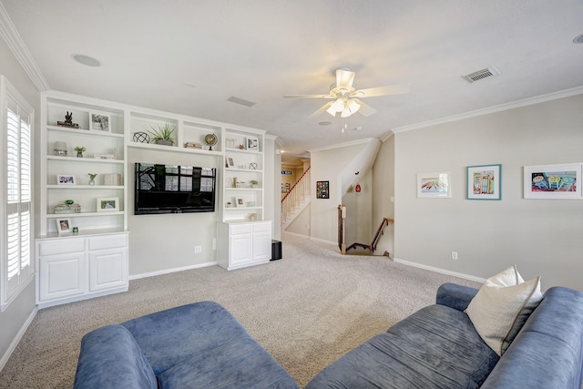 living area featuring visible vents, a wealth of natural light, and ornamental molding