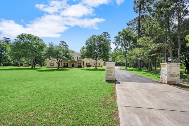 view of home's community featuring a lawn