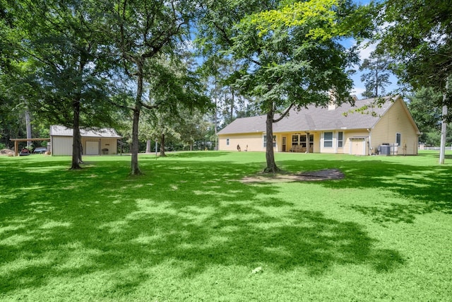 view of yard with central AC