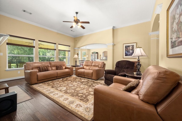 living area with a ceiling fan, wood-type flooring, crown molding, visible vents, and arched walkways