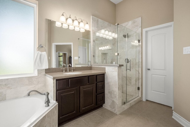 full bath featuring a stall shower, tile patterned flooring, a garden tub, and vanity