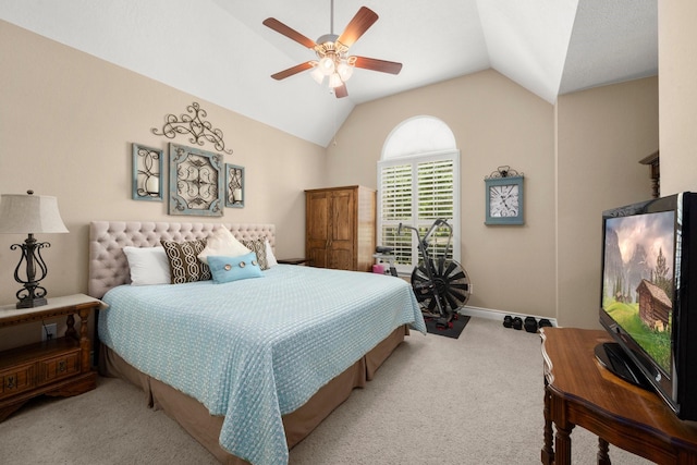 carpeted bedroom with vaulted ceiling, ceiling fan, and baseboards