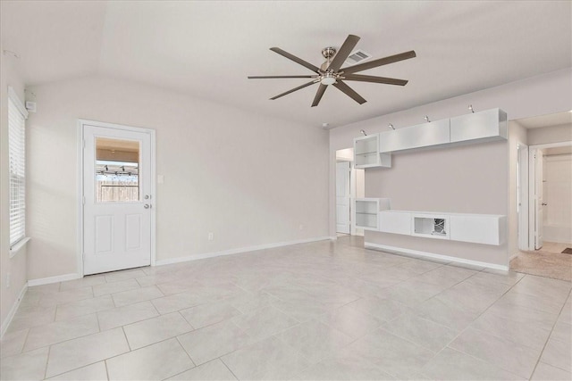 unfurnished living room with light tile patterned flooring, vaulted ceiling, visible vents, baseboards, and ceiling fan