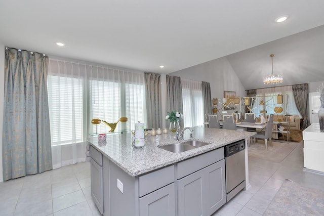 kitchen featuring dishwasher, a healthy amount of sunlight, a sink, and light tile patterned flooring