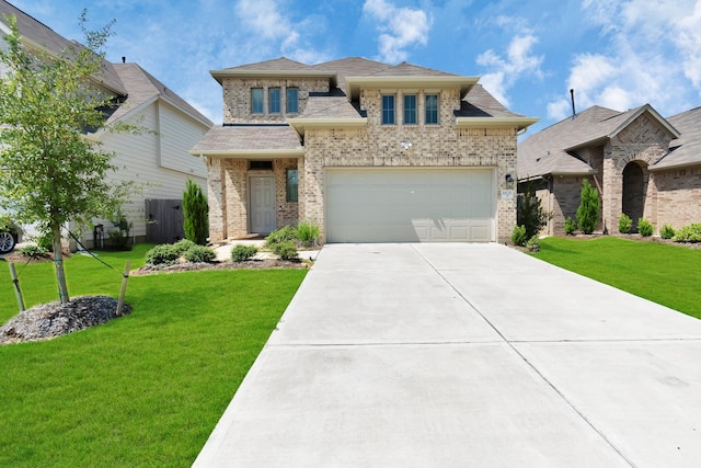 view of front of property featuring a front lawn, brick siding, driveway, and an attached garage